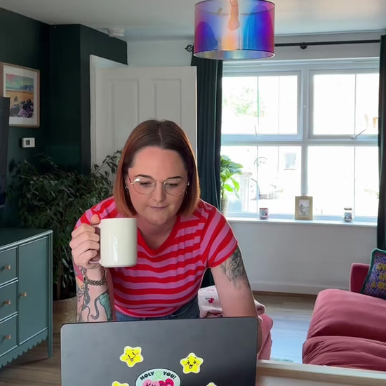 Woman working from home and then upgrading her cat litter set up with the taking care of business bundle.